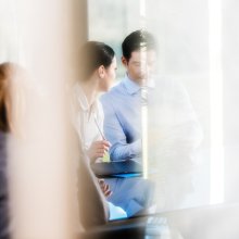 Man and woman talking in a meeting
